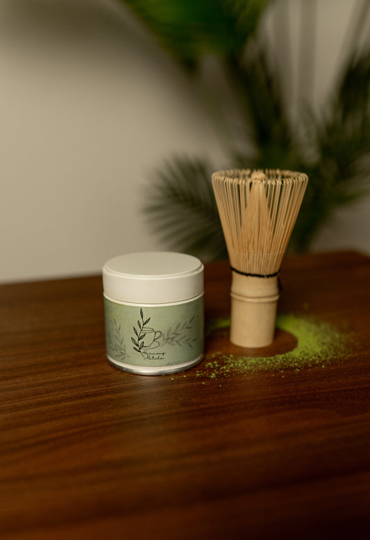 matcha tin with bamboo whisk